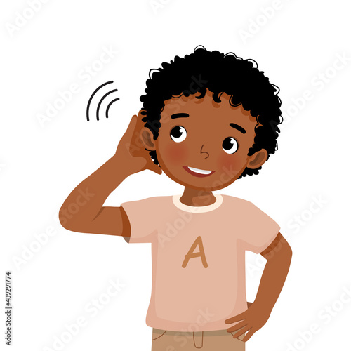 cute little African boy with hearing problem try listening attentively by putting his hand to his ear