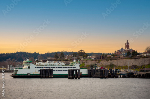 Port Townsend, Washington Ferry Dock. Ferryboat docked with the Jefferson County Courthouse in the background in this historic port city on the Olympic Peninsula. Popular  tourist destination. photo