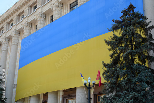 Huge flag of Ukraine on the building