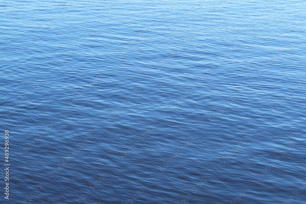 Calm light blue water surface in Florida lake, natural water background