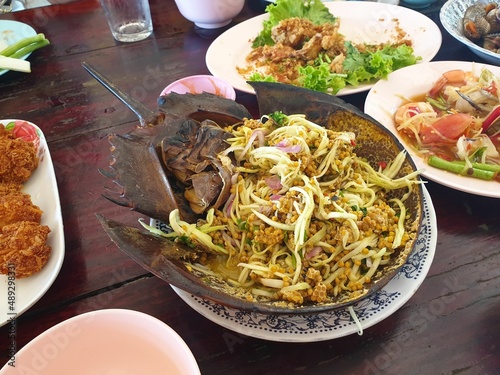 Thai seafood It's called horseshoe crab egg salad. Sour and spicy taste, put inside the whole horseshoe crab shell. photo