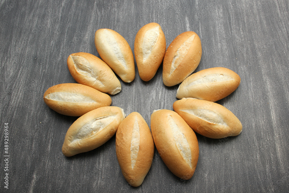 Fototapeta premium Delicious, fluffy, hot, crispy Mexican bread, bolillo white bread, loaf or French bread made with very cheap wheat flour 