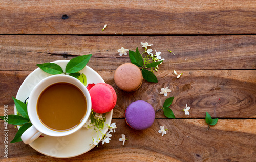 hot coffee with macaron dessert snack of lifestyle arrangement flat lay style on background wooden