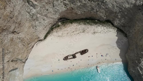 Dreamlike bird's eye view of world's most famous beach in Navagio, Zakynthos, Greece. Turquoise sea water and white sand beach with shipwrecked fishing vessel Panagiotis photo