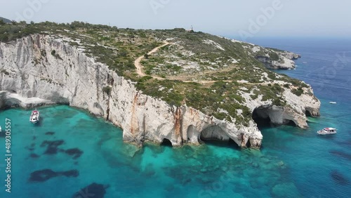 Wallpaper Mural Aerial drone video of the geological phenomenon of blue caves on Zakynthos island, Greece. Turquoise clear sea with sailing boats and yachts. Torontodigital.ca