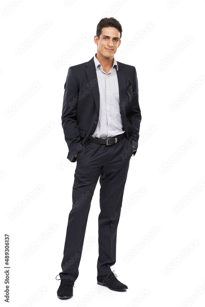 Standing tall in the business world. Full length portrait of a confident young businessman standing with his hands in his pockets. Standing tall in the business world. Full length portrait of a confident young businessman standing with his hands in his pockets.
