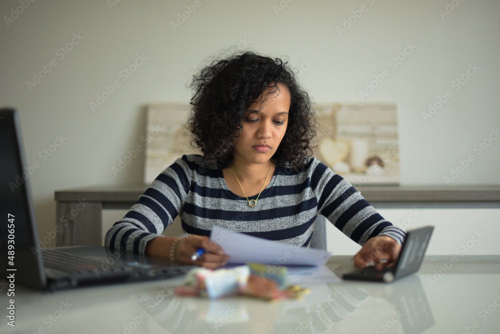metis woman checking her bills metis woman checking her bills