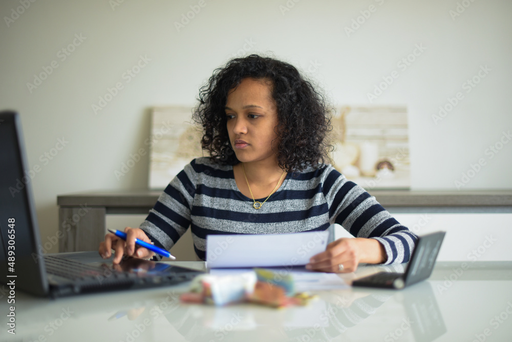 metis woman checking her bills metis woman checking her bills