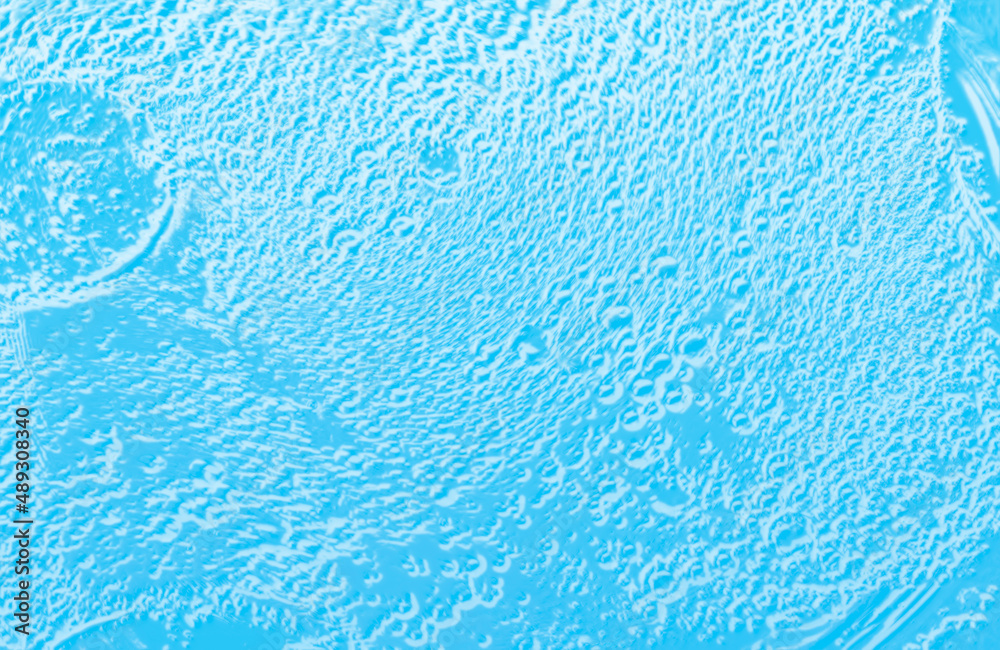 The surface of the water. An image of a drop of oil on water. Background for the design. The surface of the water. An image of a drop of oil on water. Background for the design.