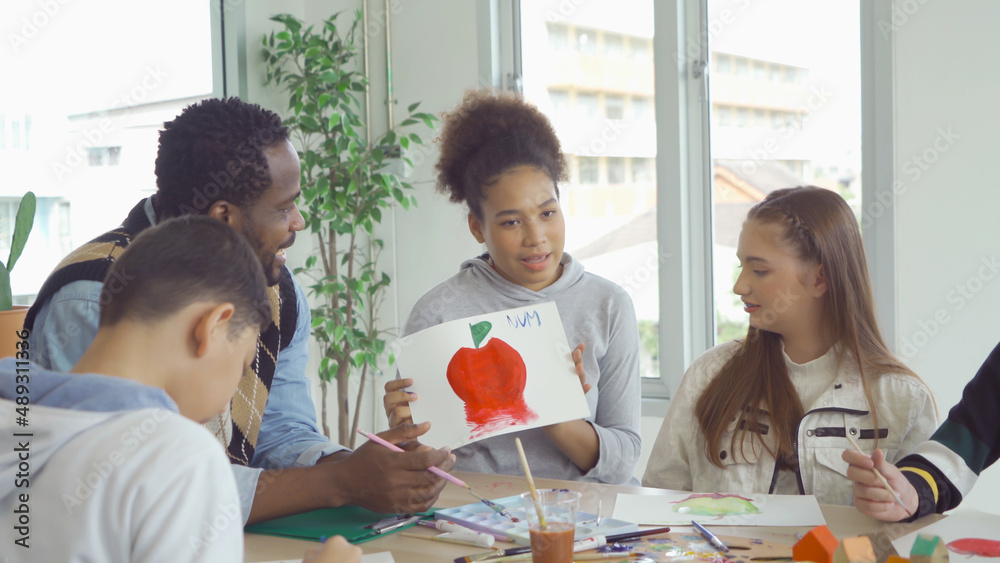 A group of multi ethnic of students kids and teachers study, learn art painting, drawing in school. Education in classroom. People lifestyle A group of multi ethnic of students kids and teachers study, learn art painting, drawing in school. Education in classroom. People lifestyle