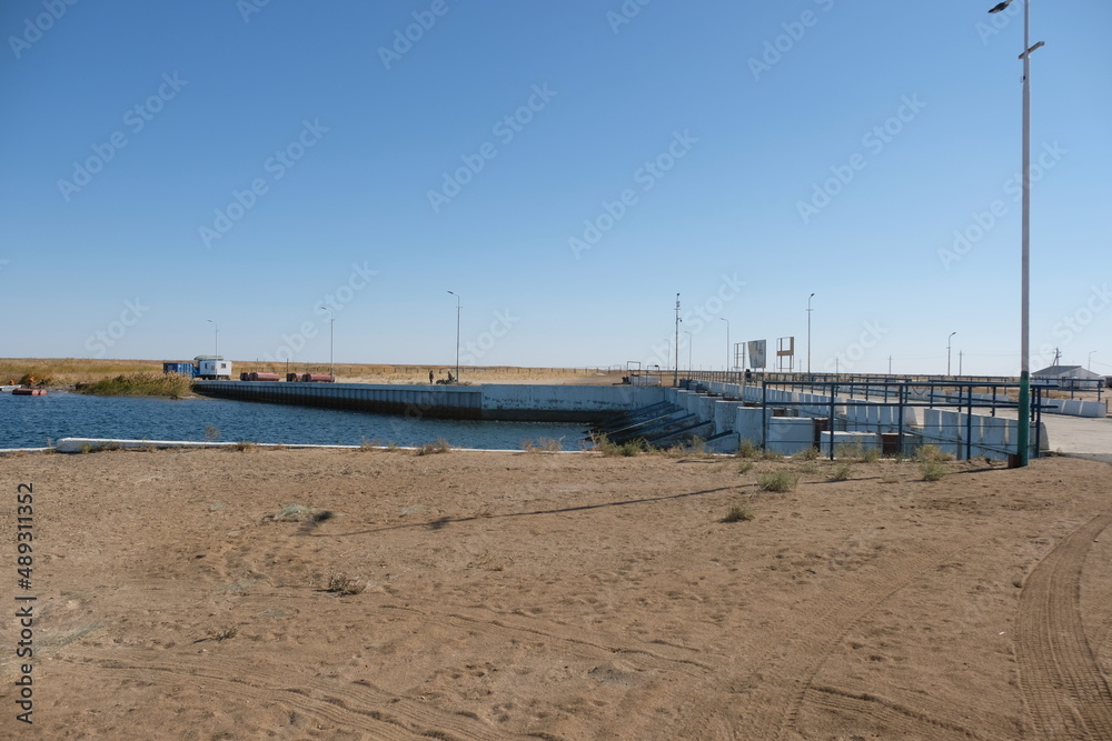 Aralsk, Kazakhstan - 10.06.2020 : The territory of the Kokaral dam. Regulation of the water level in the small Aral Sea.