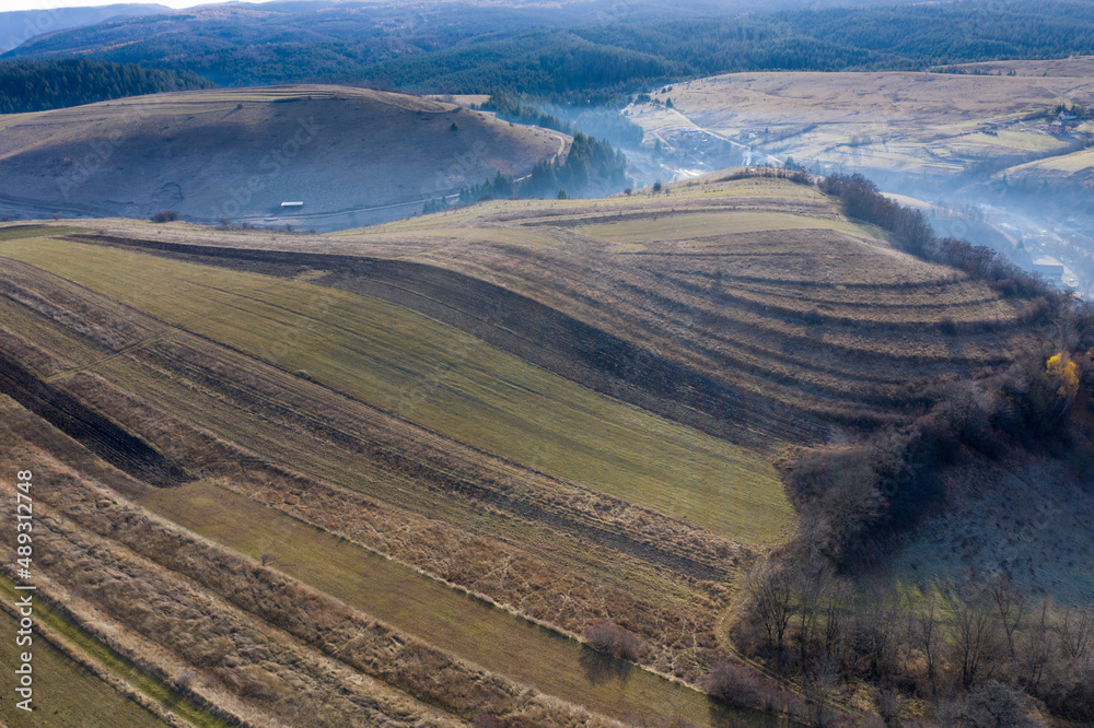 Fototapeta premium Aerial view of a small countryside village in the autumn