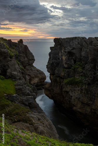 Cliff pools sunset over the ocean