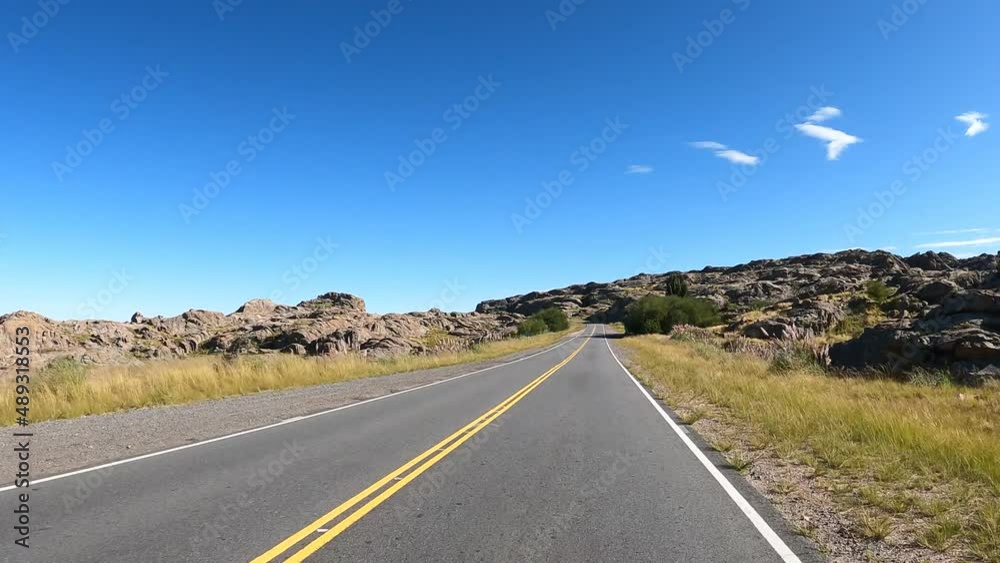 Spectacular Pov Driving Along Lonely Road in Cordoba,Argentina during blue sky and sunlight - Between rocks and boulders with ocean in background
Spectacular Pov Driving Along Lonely Road in Cordoba,Argentina during blue sky and sunlight - Between rocks and boulders with ocean in background