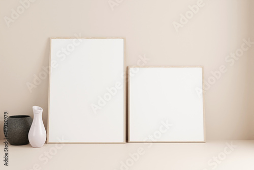 Set of minimalist wooden poster or photo frame mockup on the floor leaning against the room wall