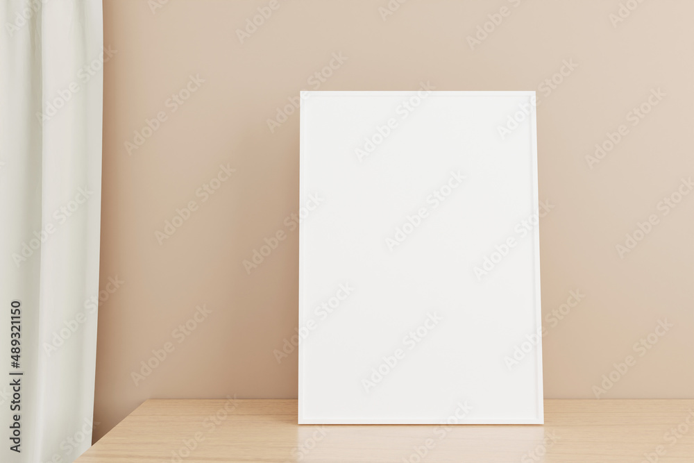 Minimalist and clean vertical white poster or photo frame mockup on the wooden table in living room Minimalist and clean vertical white poster or photo frame mockup on the wooden table in living room