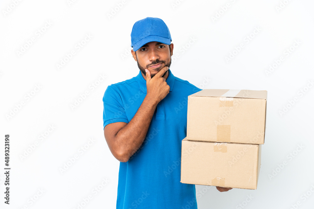 Delivery Ecuadorian man isolated on white background thinking Delivery Ecuadorian man isolated on white background thinking