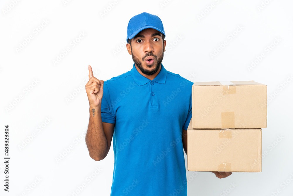 Delivery Ecuadorian man isolated on white background intending to realizes the solution while lifting a finger up Delivery Ecuadorian man isolated on white background intending to realizes the solution while lifting a finger up