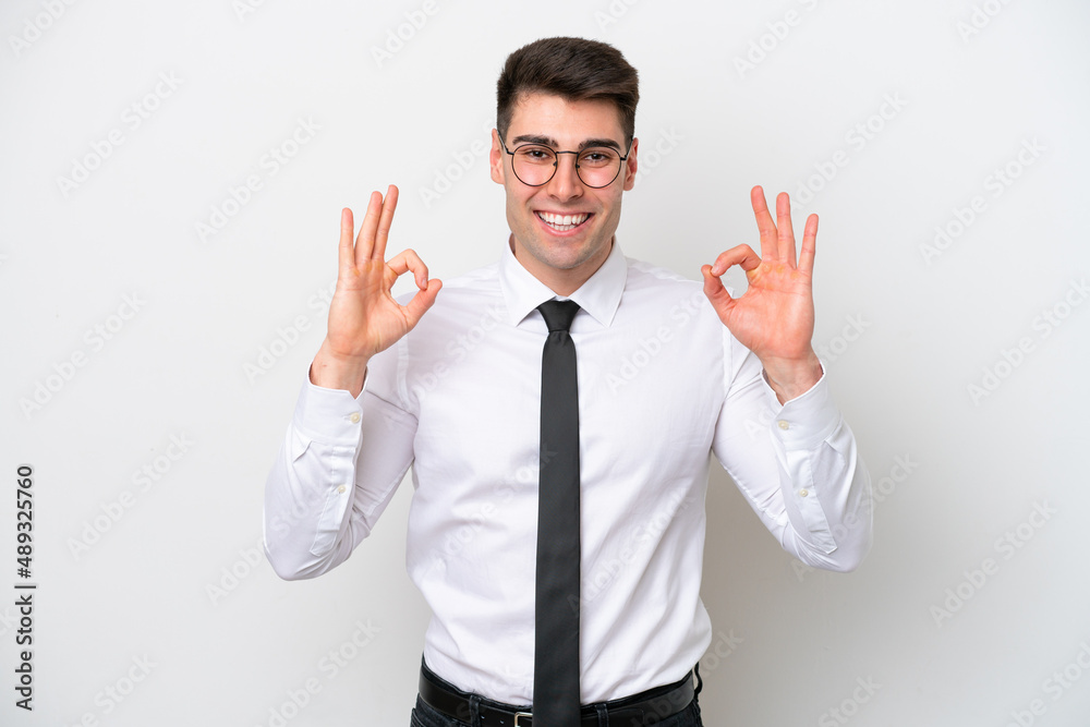 Business caucasian man isolated on white background showing an ok sign with fingers Business caucasian man isolated on white background showing an ok sign with fingers
