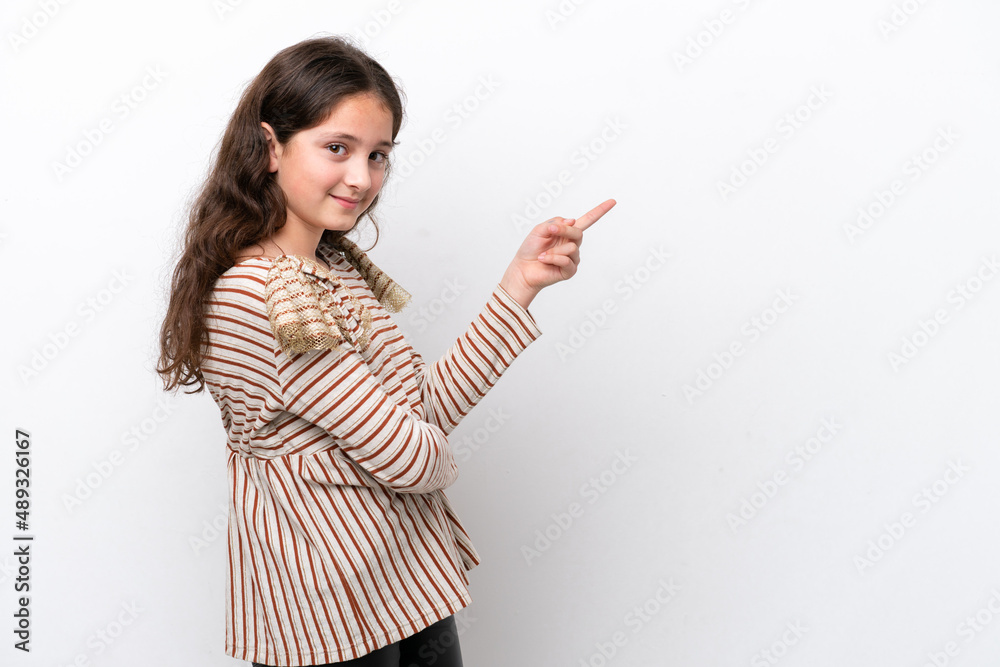 Little girl isolated on white background pointing finger to the side Little girl isolated on white background pointing finger to the side