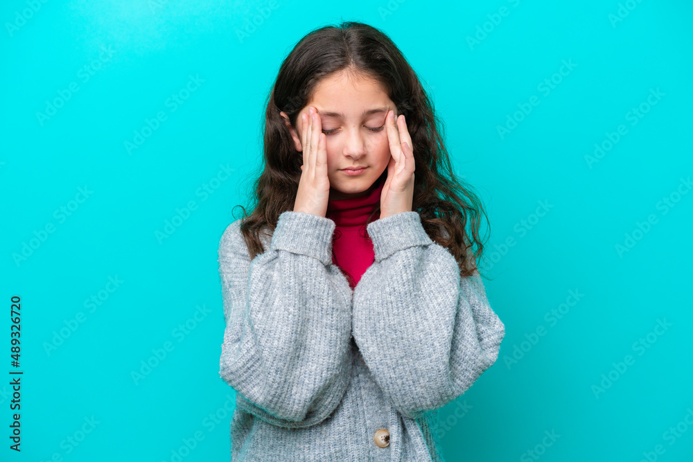 Little girl isolated on blue background with headache Little girl isolated on blue background with headache
