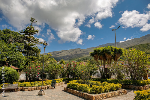 View from a neat park to mountains and blue sky with white clouds, Villa de Leyva, Colombia
