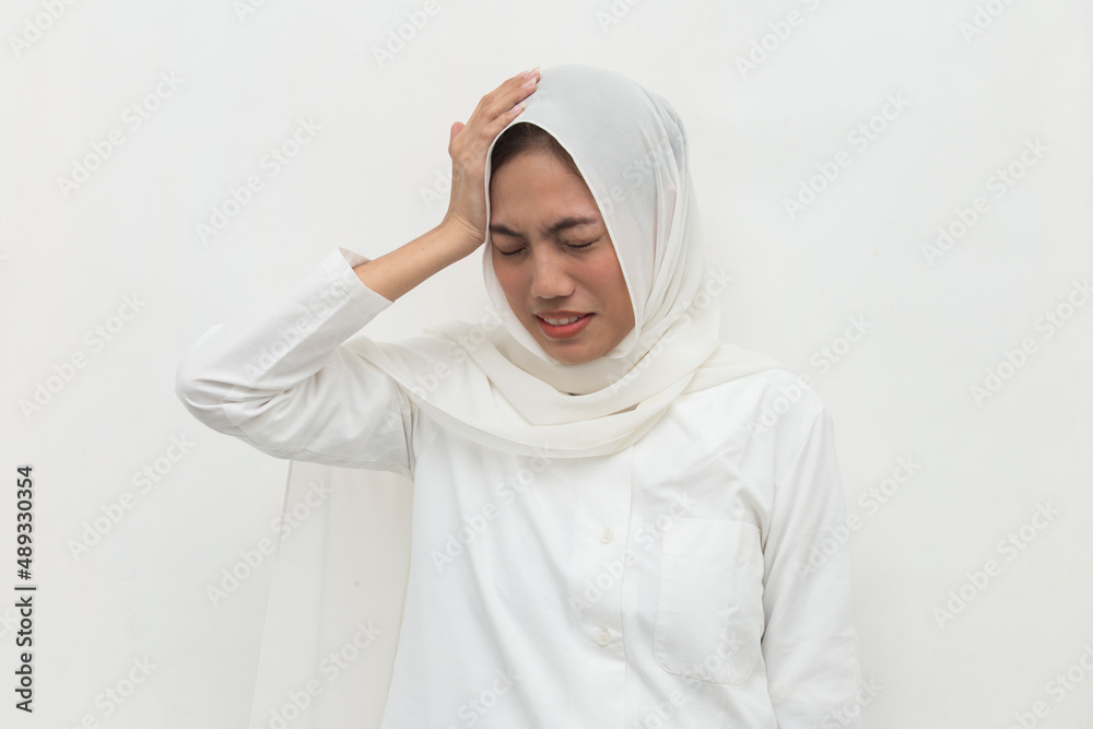 stressed sick muslim woman with headache; ill woman suffers from vertigo, dizziness, migraine, hangover, stressed sick muslim woman with headache; ill woman suffers from vertigo, dizziness, migraine, hangover,