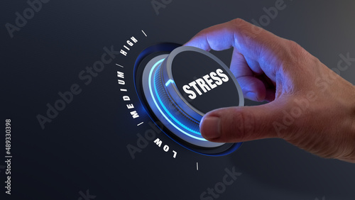 Reduce stress with hand turning knob to lower levels. Burnout, exhaustion, overload, pressure at the workplace and management concept. Relieve tension.