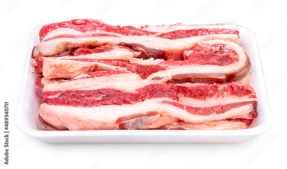 Sliced brisket beef in package isolated on white background, Sliced lean meat red beef on White With clipping path.