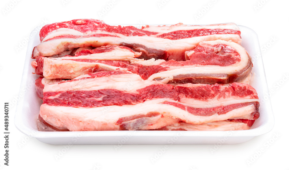 Sliced brisket beef in package isolated on white background, Sliced lean meat red beef on White With clipping path. Sliced brisket beef in package isolated on white background, Sliced lean meat red beef on White With clipping path.