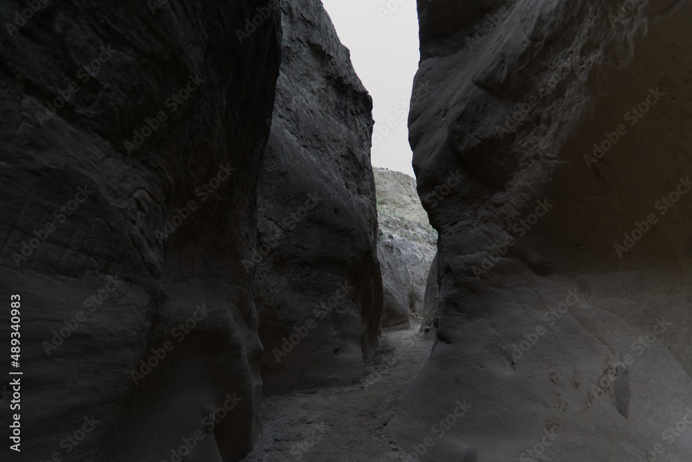 The narrow walls of the Los Hoyos trail in the gray desert of Tatacoa, Colombia