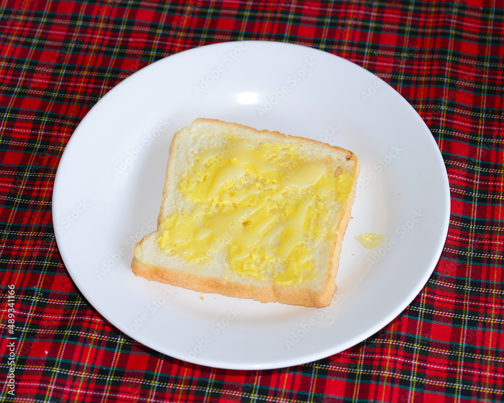 slices of wheaten bread spreaded with butter slices of wheaten bread spreaded with butter