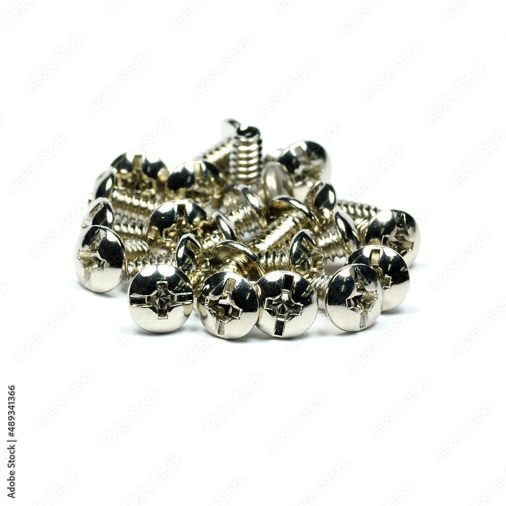 Chrome nuts and bolts on white background close-up Chrome nuts and bolts on white background close-up
