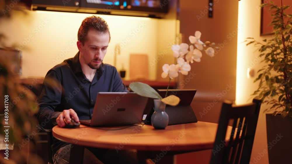 Businessman work on laptop computer in kitchen with bad back posture 4K Businessman work on laptop computer in kitchen with bad back posture 4K