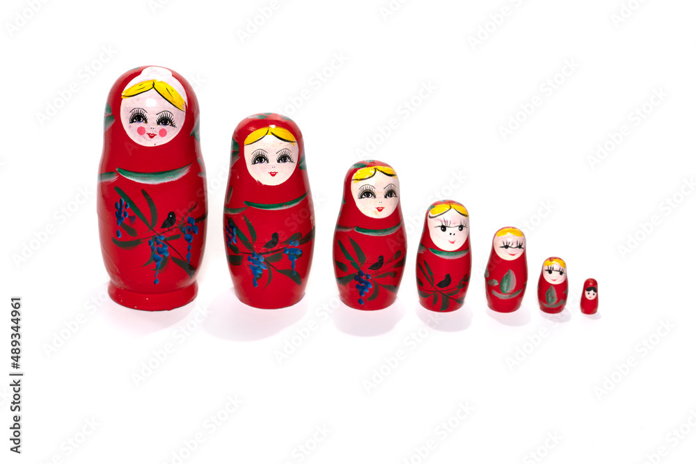 Red colored nesting dolls on a white background. Matryoshka.