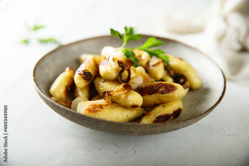 Traditional German potato dumplings with fried onion Traditional German potato dumplings with fried onion