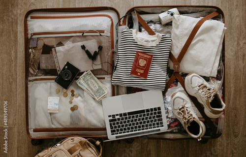 open suitcase with clothes and things
