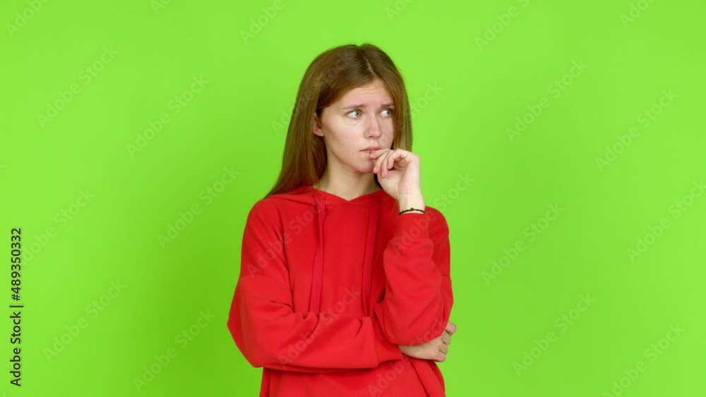 Young woman having doubts and questioning an idea over isolated background. Green screen chroma key Young woman having doubts and questioning an idea over isolated background. Green screen chroma key