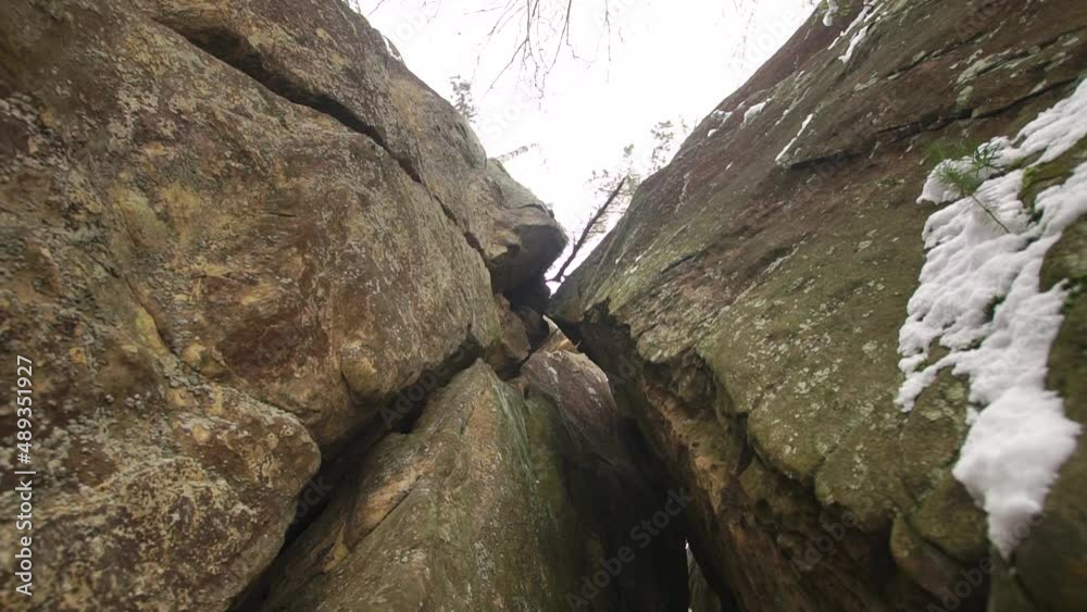 Vertical rocks with sharp edges close-up in winter Vertical rocks with sharp edges close-up in winter