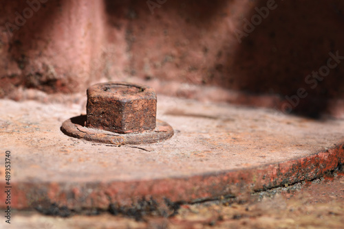 rusty nut and washer on steel structure . corrosion of steel photo
