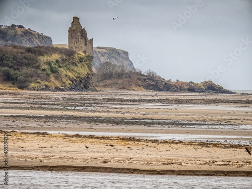 Looking across the beach to Greenan Castle Ayr in winter photo