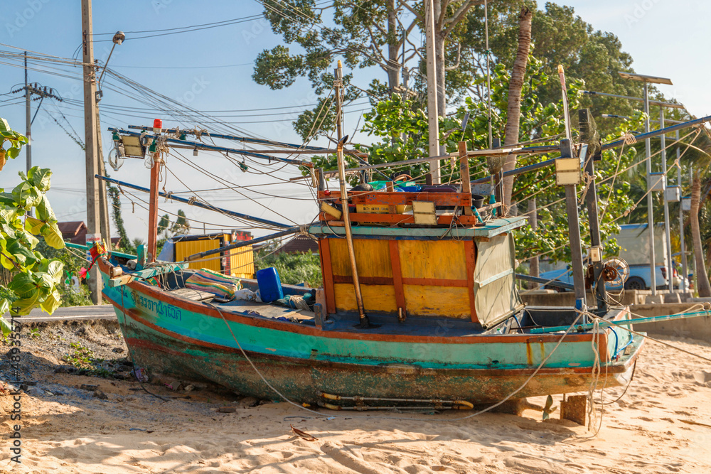old and rotten fishing boat at a thailand beach