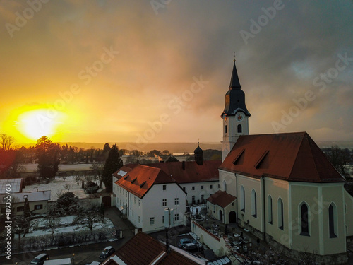 Church at sunset in winter, photographed with a drone