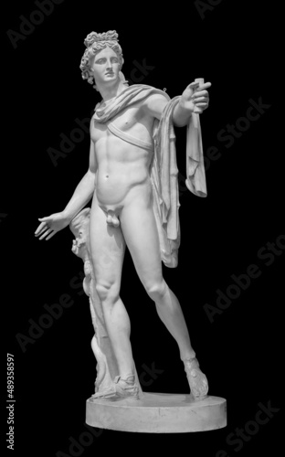 God Apollo sculpture. Ancient Greek god of Sun and Poetry Plaster copy of a marble statue isolated on black with clipping path