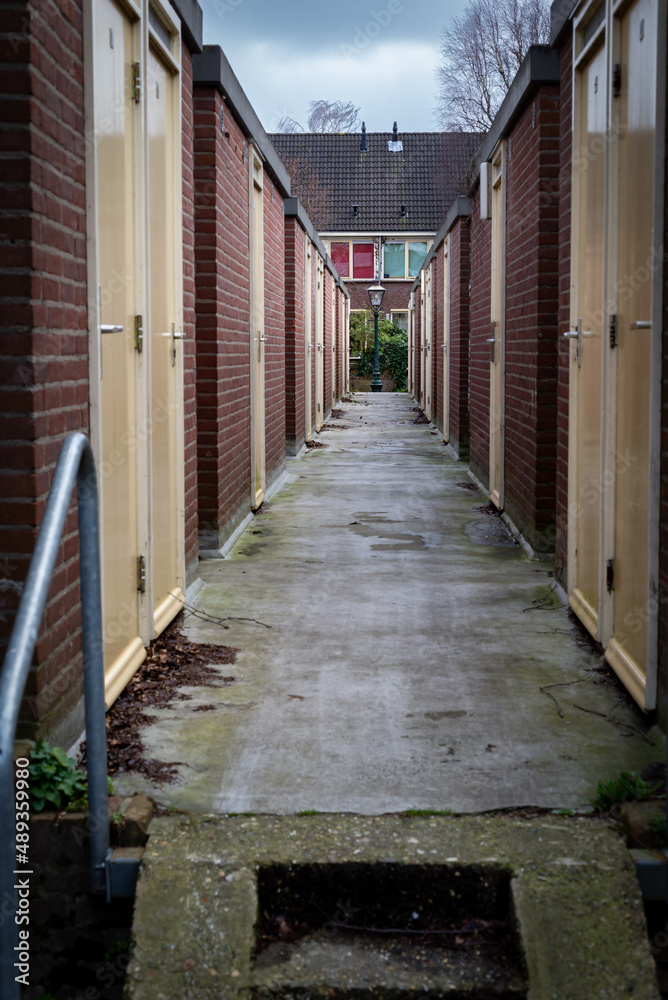 View on backyard entrance of traditional Dutch houses View on backyard entrance of traditional Dutch houses