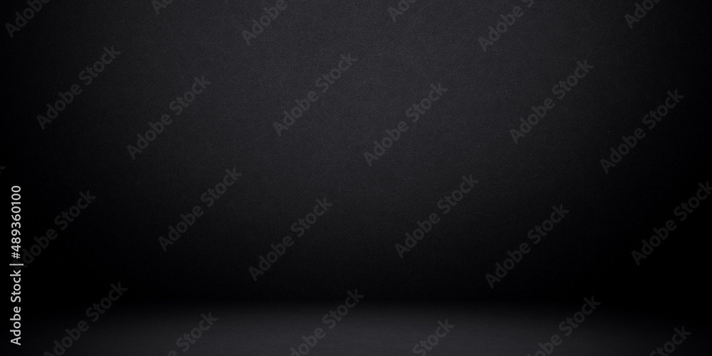 Black background with bright spotlight to wall and ground for your product backdrop concept Black background with bright spotlight to wall and ground for your product backdrop concept