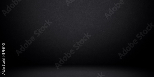 Black background with bright spotlight to wall and ground for your product backdrop concept