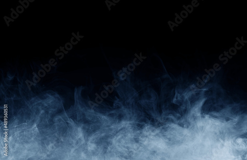 Smoke over black background. Fog or steam texture.