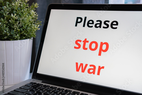 the inscription on the laptop monitor screen "say no to war"