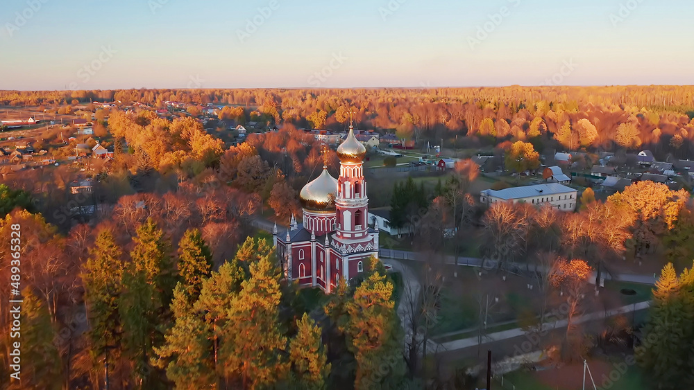Autumn forest, Christian temple, beautiful nature shots from a drone, sunset, beauty of Russia, Buryatino village, aerial view Autumn forest, Christian temple, beautiful nature shots from a drone, sunset, beauty of Russia, Buryatino village, aerial view